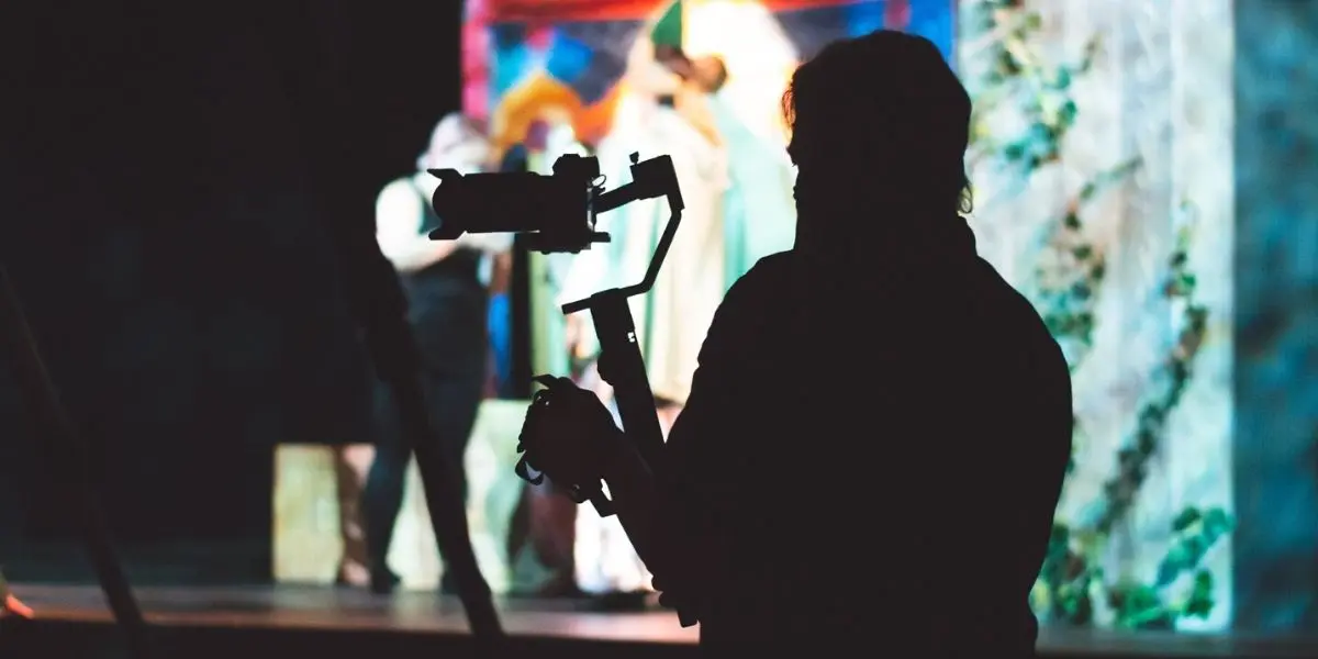 On-site video production is an image of a person behind an camera 