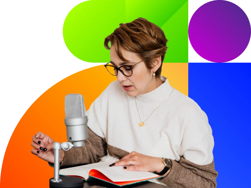 Woman reading book aloud into a microphone