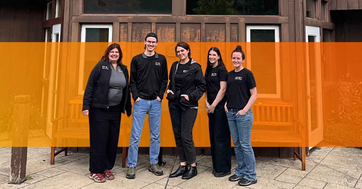 Riveo team members standing together outside a building.