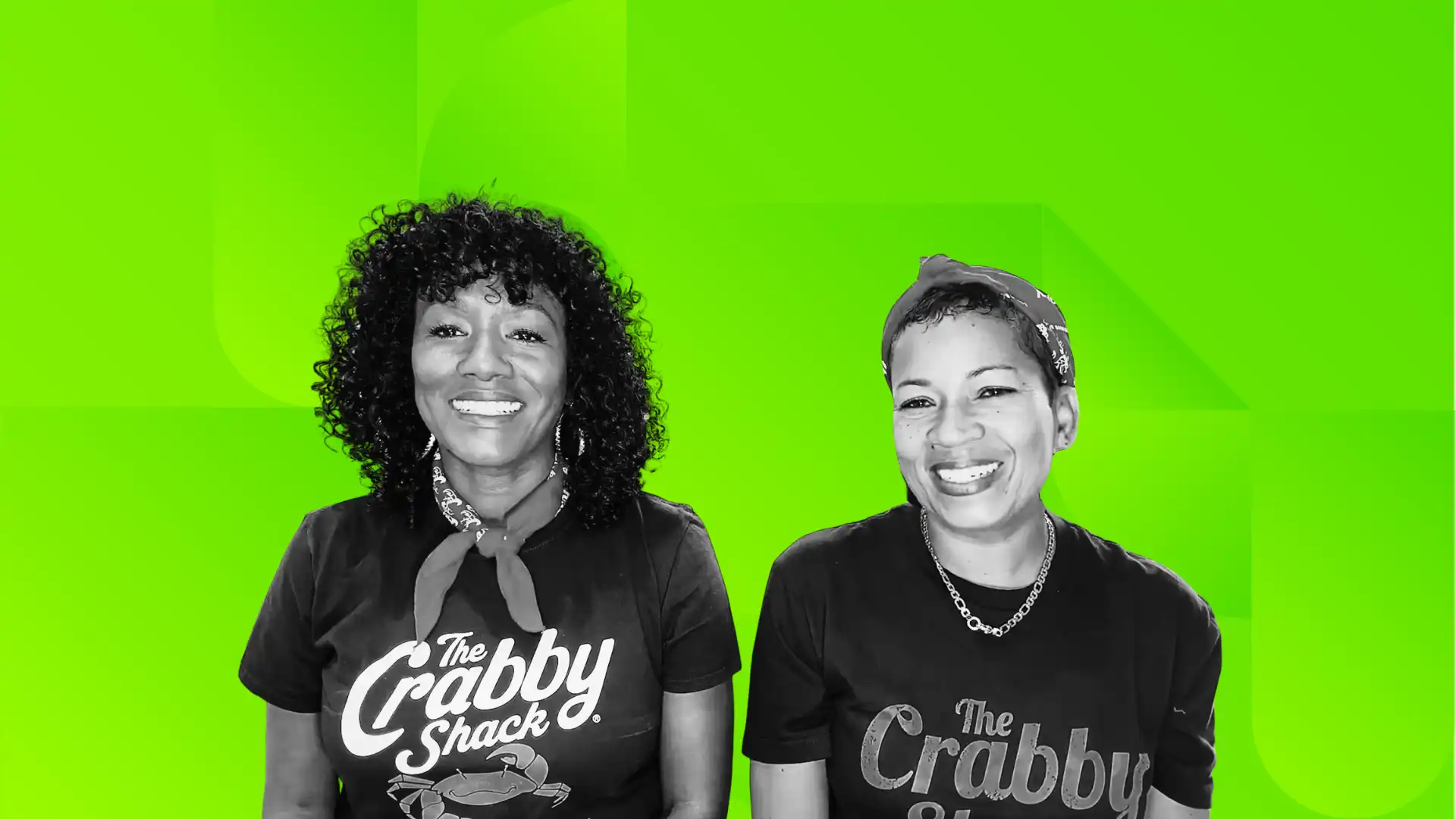 Two Black women business owners wearing shirts that say their business name: The Crabby Shake.